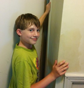 Kyler tearing down wallpaper